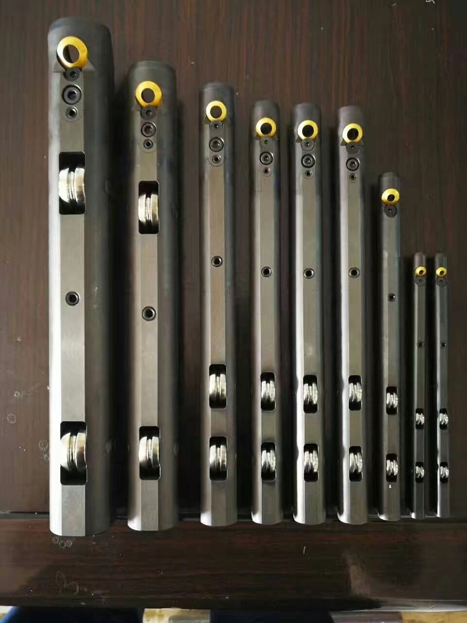Internal weld bead scarfing tools for precision steel tubes