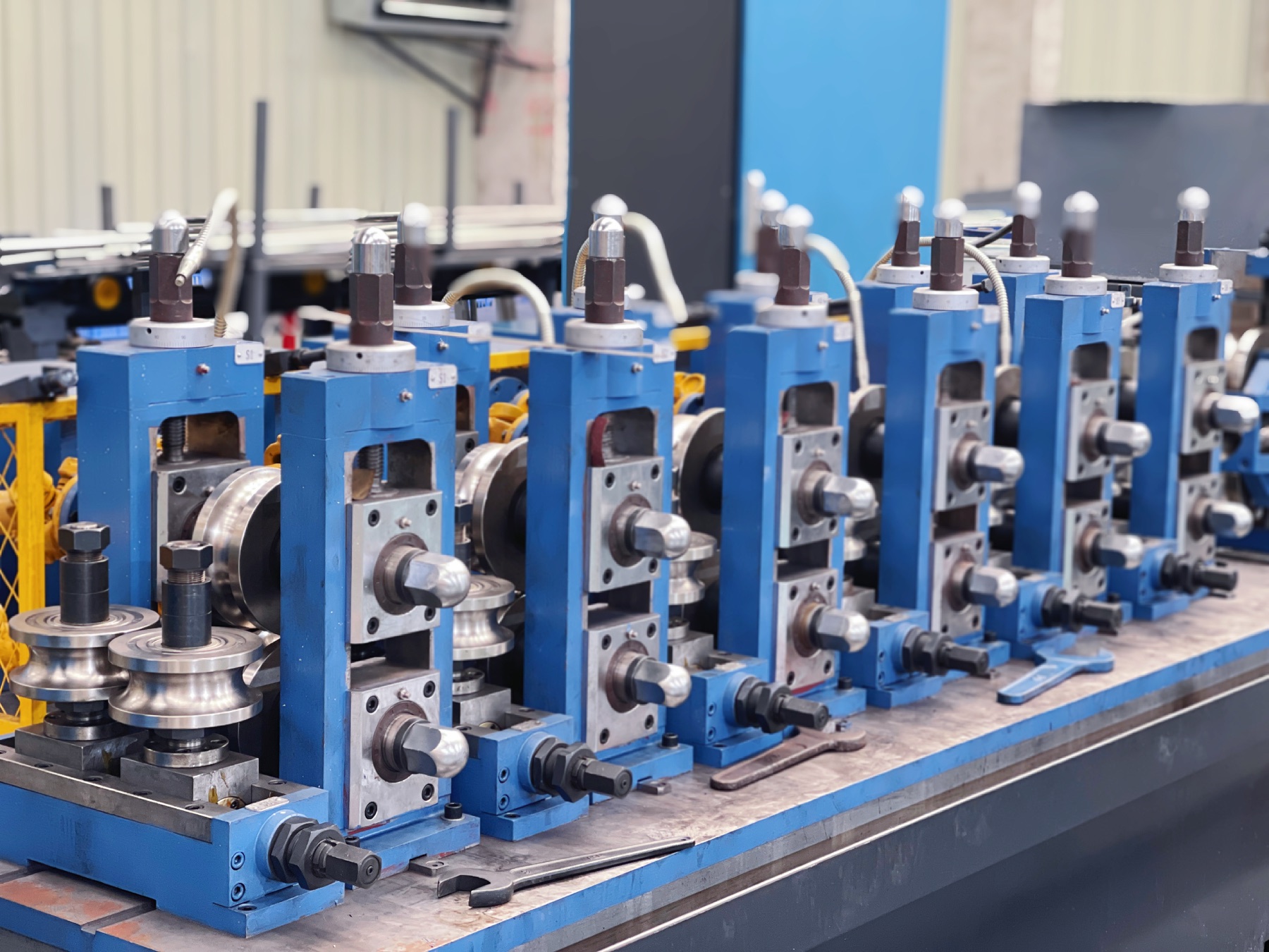 Precision steel tube forming and sizing stands