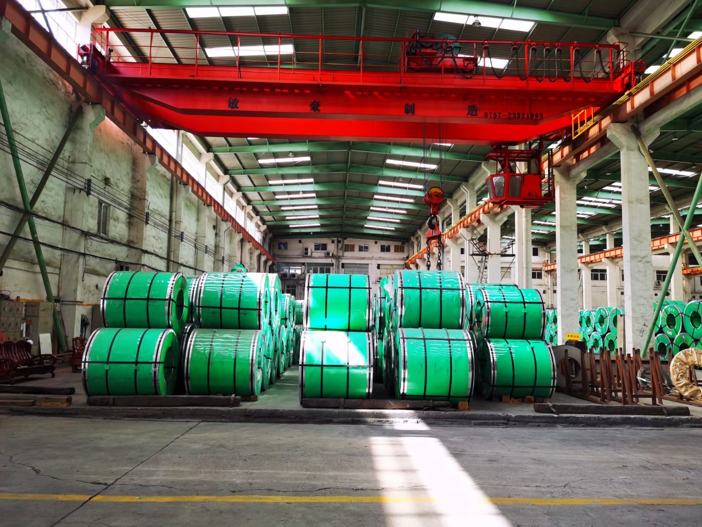 Master steel coils staged in the material warehouse