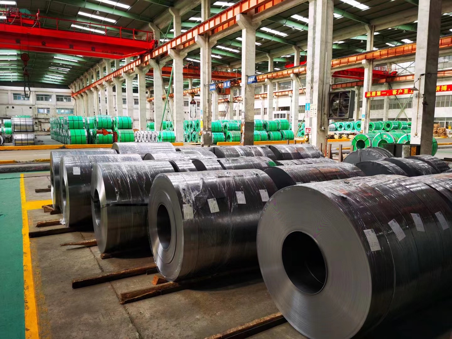 Finished slit steel coils organized on the production floor