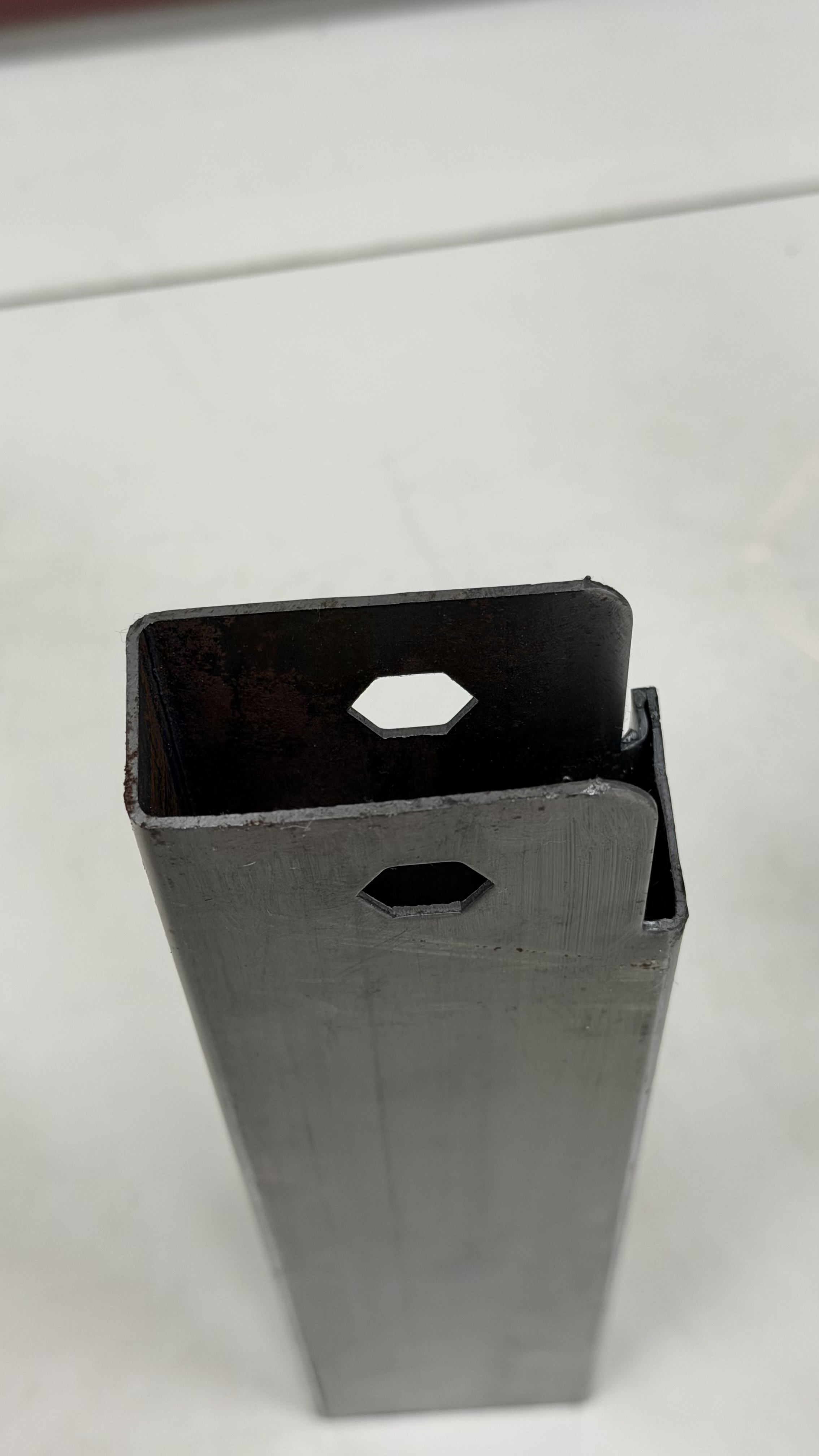 Custom steel tube profile with engineered openings